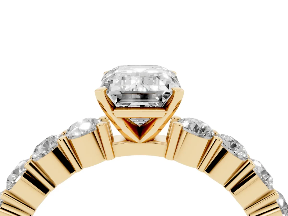 Emerald Cut Diamond Solitaire Ring with Shared Prong Round Side Stones Yellow gold