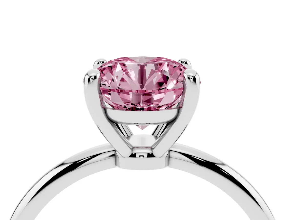 Fancy Pink Round Cut Solitaire Diamond Ring with 4-Prong Setting on a Classic Band Platinum