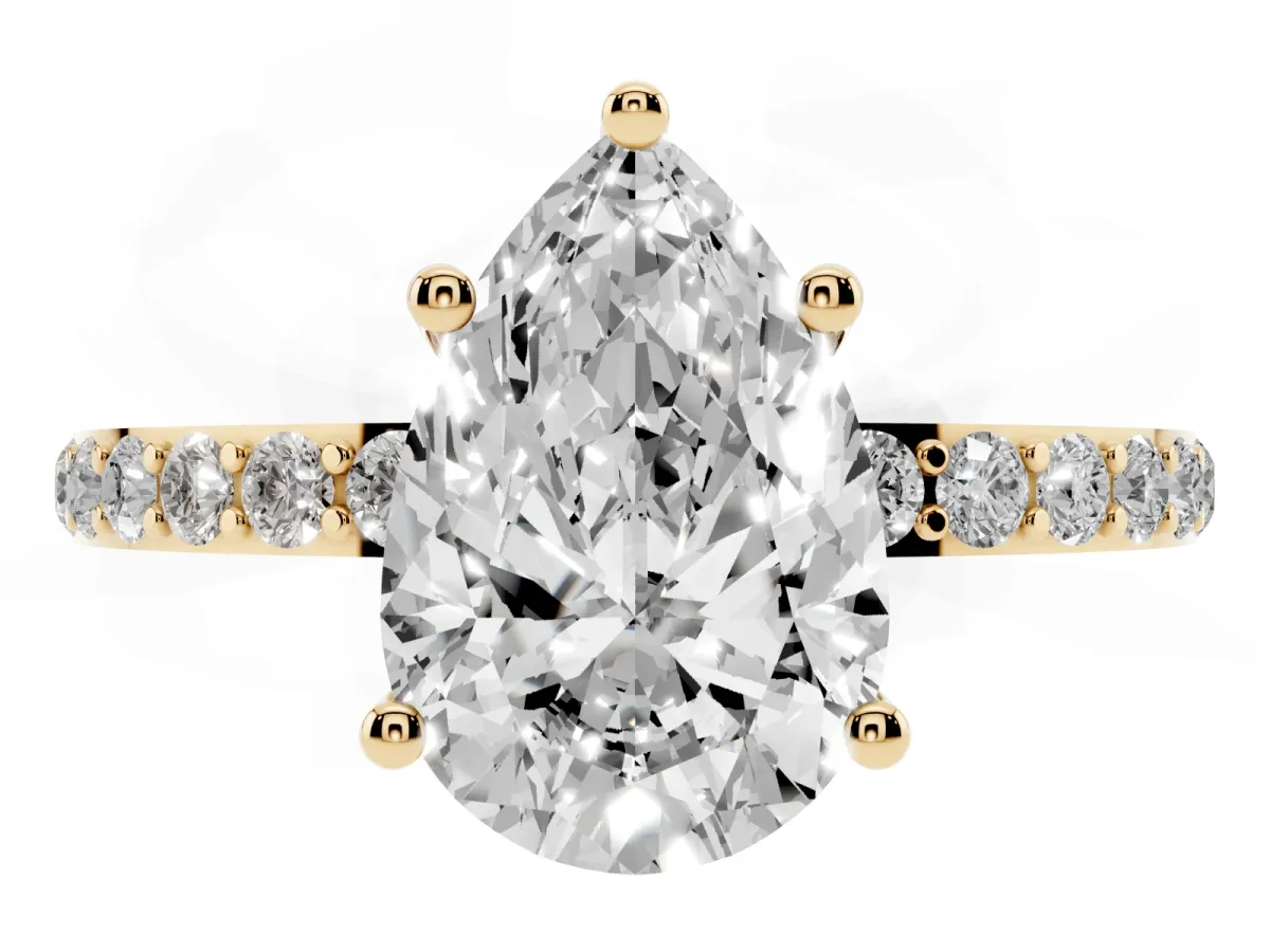 Pear Cut Diamond Solitaire Ring with Round Pavé Shoulders and Prong Setting Yellow gold