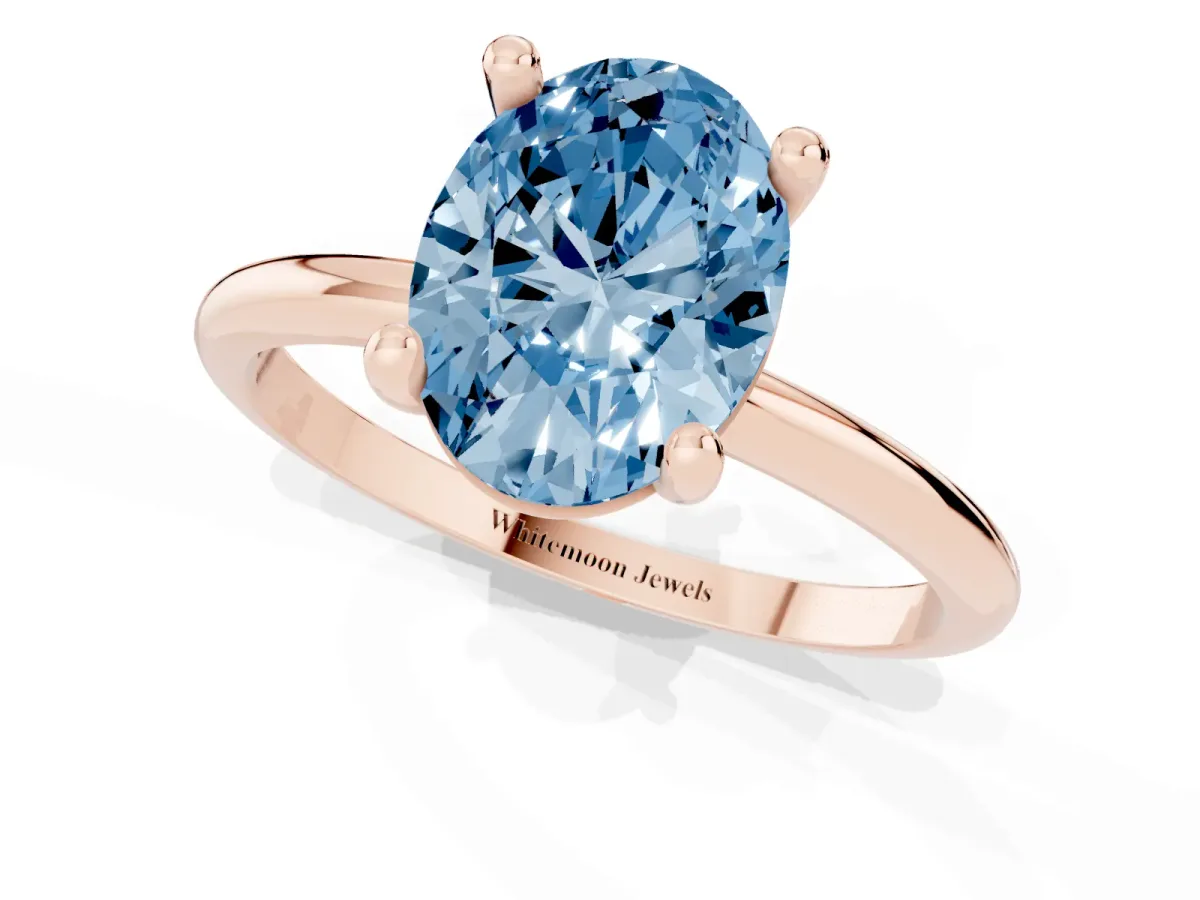 Fancy Blue Oval Cut Solitaire Diamond Ring with 4-Prong Setting on a Classic Band Rose gold