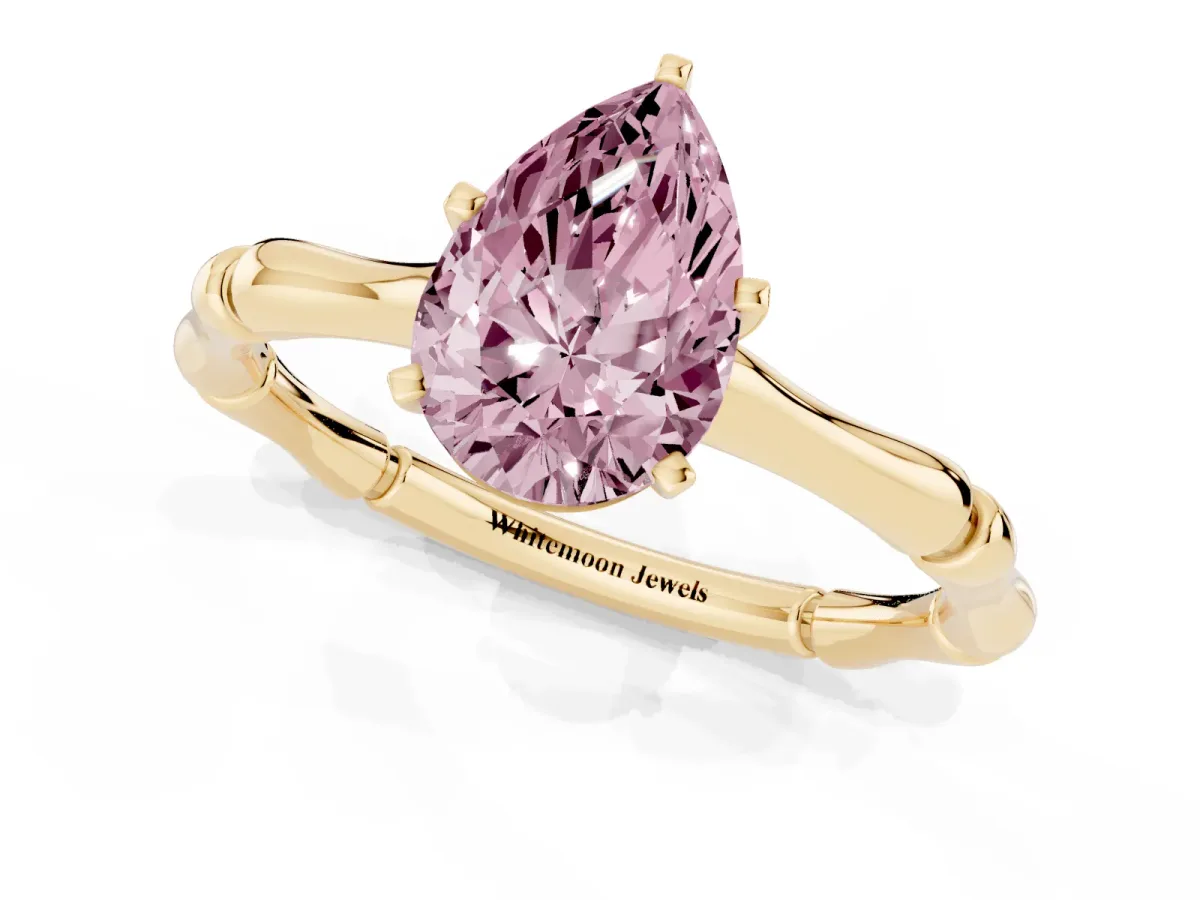 Fancy Pink Pear Cut Solitaire Diamond Ring with Bamboo Band and Four-Prong Setting Yellow gold