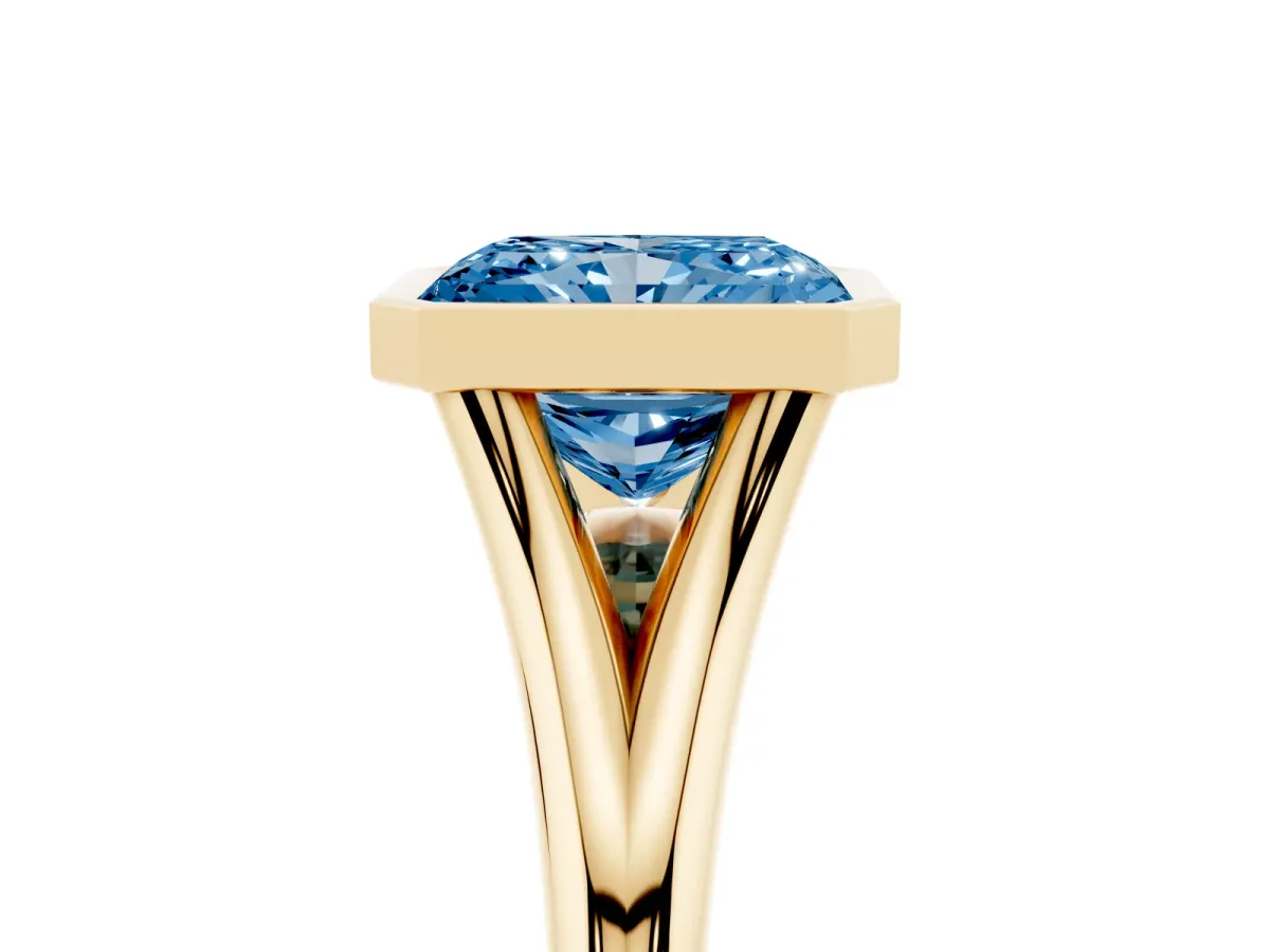 Fancy Blue Bezel Set Radiant Cut Cut Solitaire Ring with Tapered Band Yellow gold