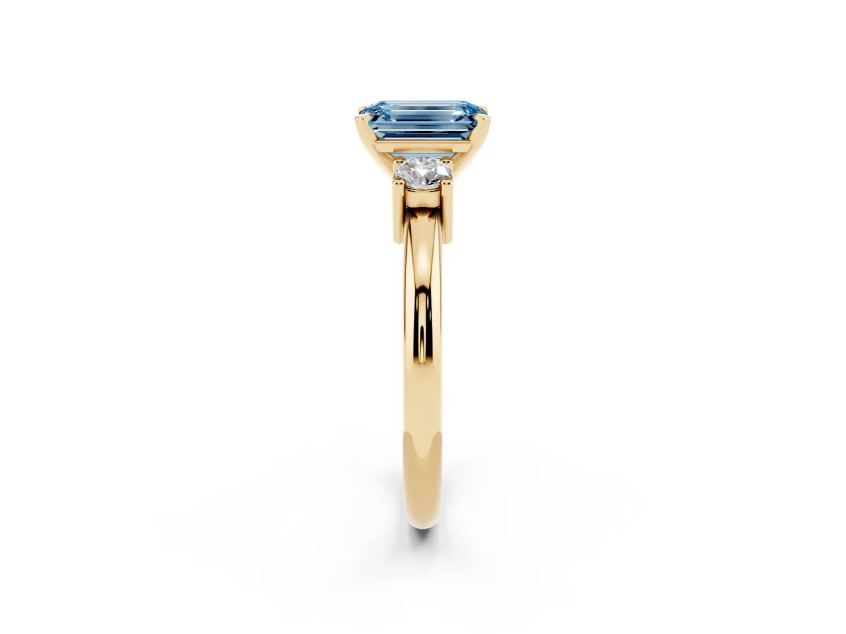 Fancy Blue Three-Stone Emerald Cut Cut Diamond Solitaire with Prong Setting and Classic Band Yellow gold