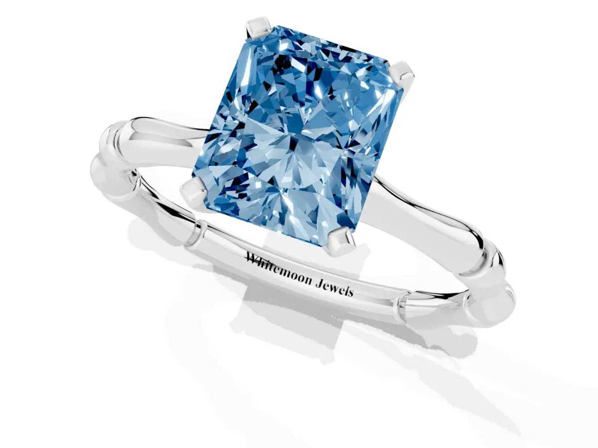Fancy Blue Radiant Cut Solitaire Diamond Ring with Bamboo Band and Four-Prong Setting Silver