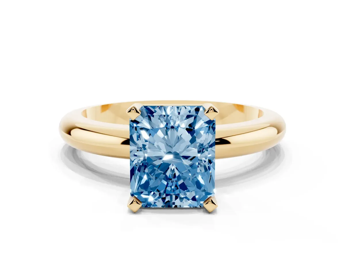 Fancy Blue Radiant Cut Diamond Solitaire Engagement Ring with Round Band and Four-Prong Setting Yellow gold