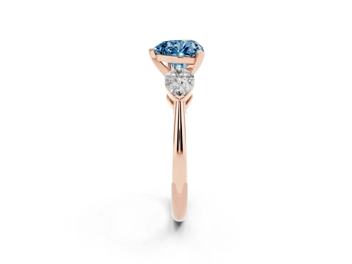 Fancy Blue Three-Stone Heart Cut Diamond Ring with Pear Side Stones and Four-Prong Setting Rose gold