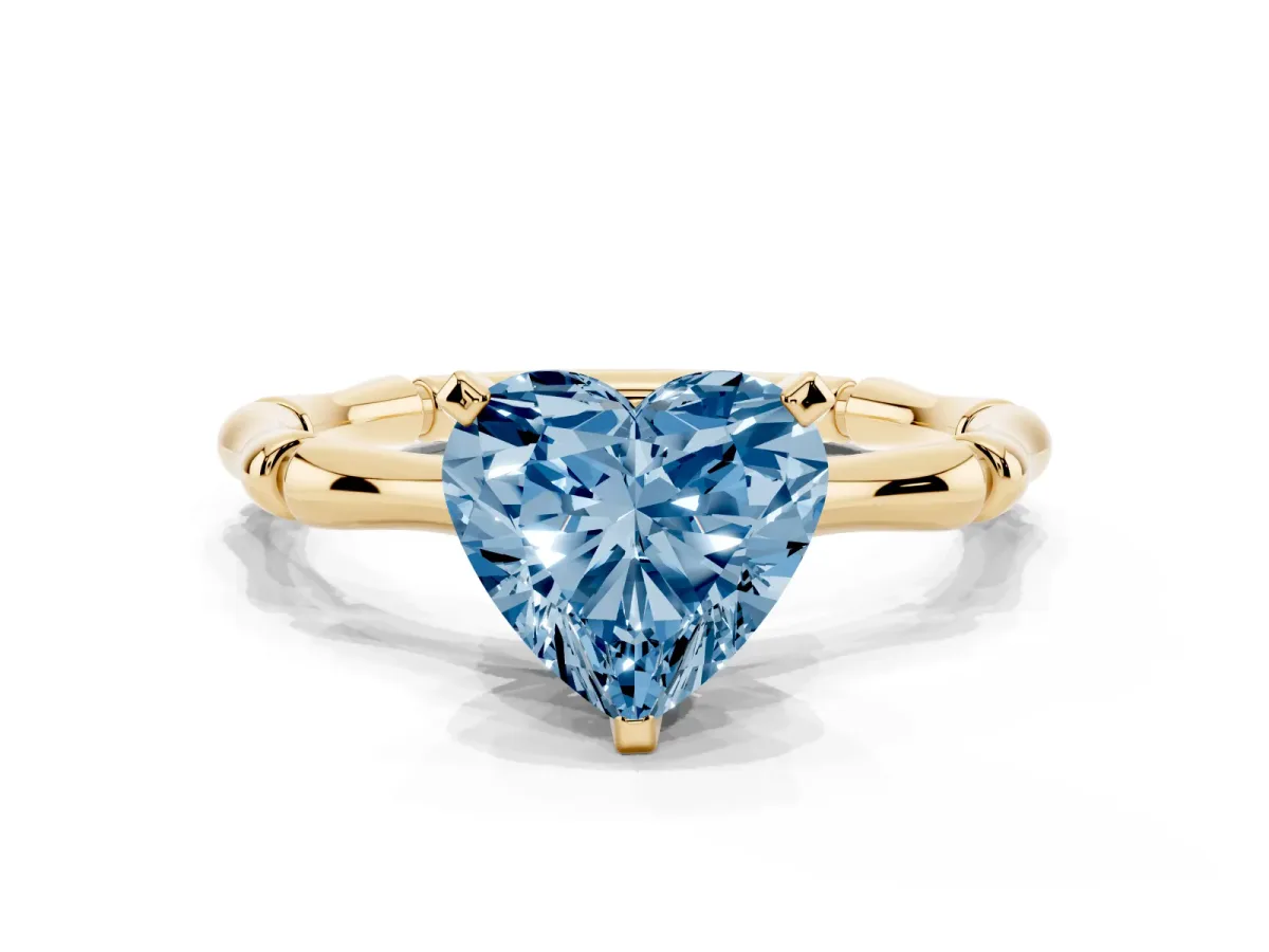 Fancy Blue Heart Cut Solitaire Diamond Ring with Bamboo Band and Four-Prong Setting Yellow gold