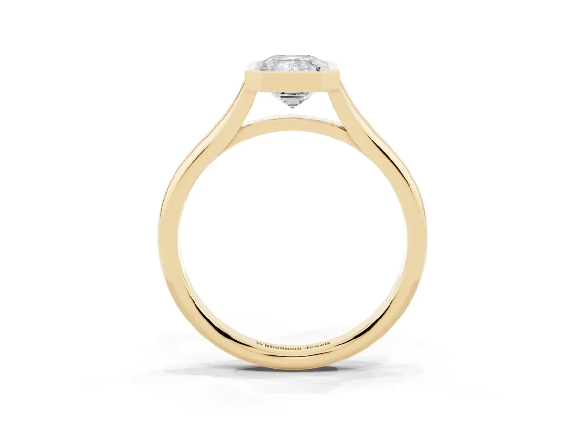 Bezel Set Emerald Cut Cut Solitaire Ring with Tapered Band Yellow gold