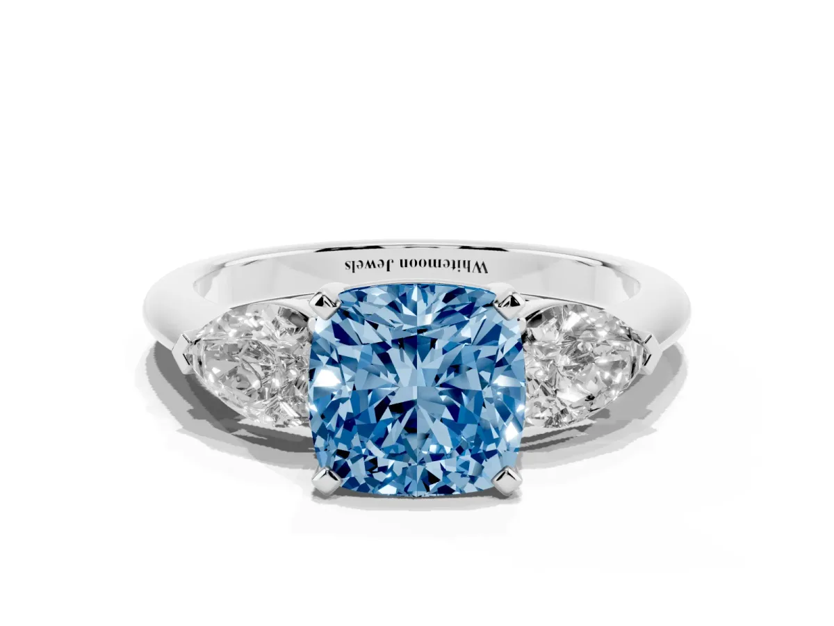 Fancy Blue Three-Stone Cushion Cut Diamond Ring with Pear Side Stones and Four-Prong Setting Platinum