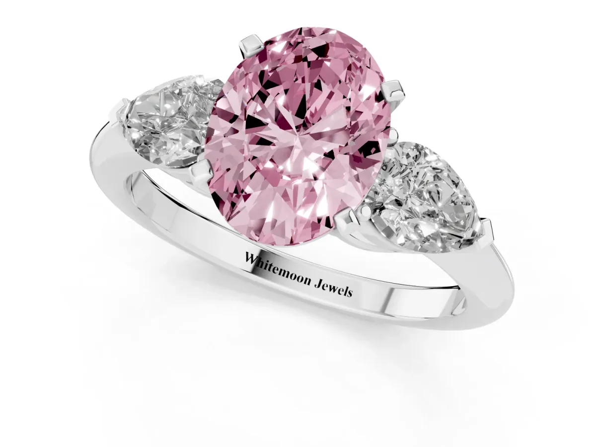 Fancy Pink Three-Stone Oval Cut Diamond Ring with Pear Side Stones and Four-Prong Setting Silver