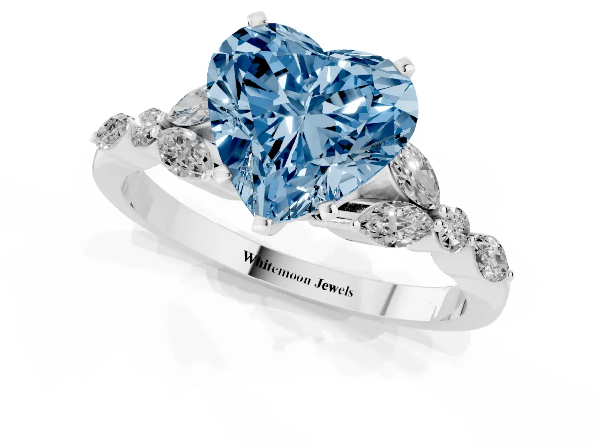Fancy Blue Heart Cut Diamond Solitaire Ring with Side Stones and Four-Prong Setting Platinum
