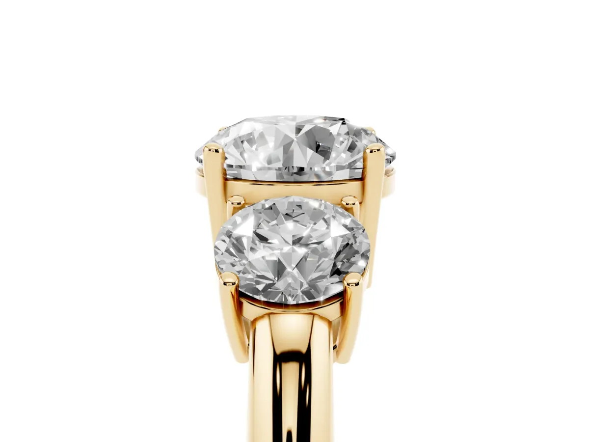 Three-Stone Round Cut Cut Diamond Engagement Ring with Prong Setting on a White Gold Band Yellow gold
