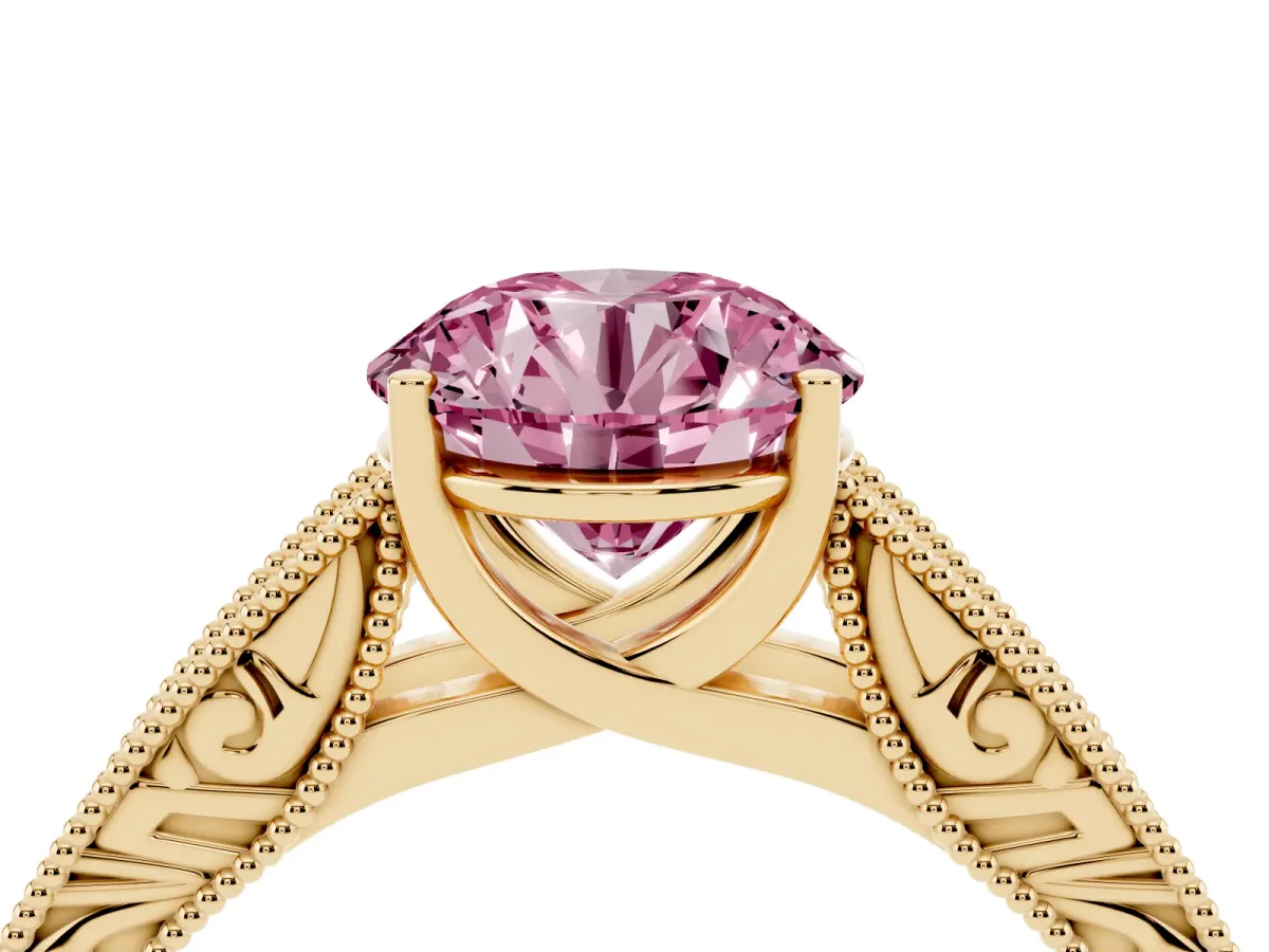 Fancy Pink Round Cut Diamond Solitaire Ring with Engraved Band and Four-Prong Setting Yellow gold