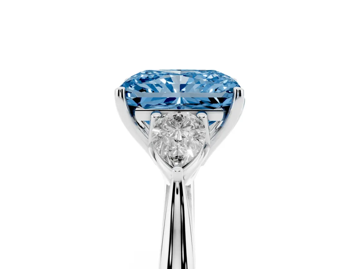 Fancy Blue Radiant Cut Diamond Three-Stone Ring with Pear Side Stones and Prong Setting Platinum