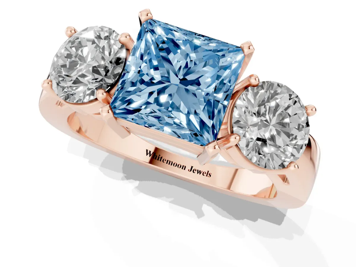 Fancy Blue Three-Stone Princess Cut Diamond Ring with Round Side Stones, Classic Band, and Four-Prong Setting Rose gold
