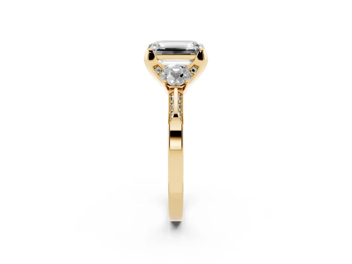 Fancy Black Emerald Cut Brilliant Three-Stone Diamond Ring with Pavé Band and Four-Prong Setting Yellow gold