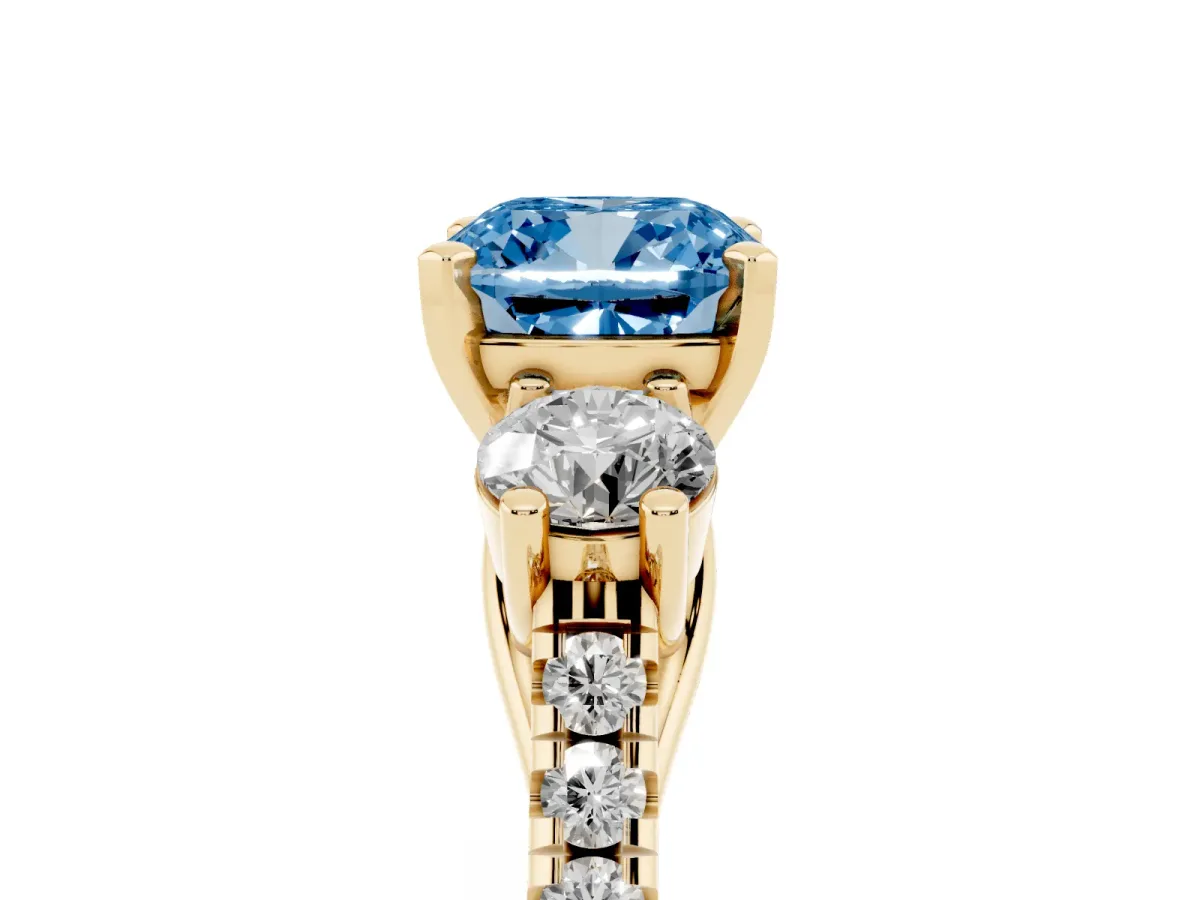 Fancy Blue Three-Stone Cushion Cut Diamond Pavé Band with Four-Prong Setting Yellow gold
