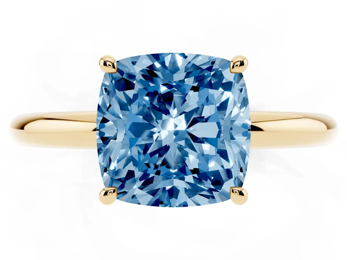 Fancy Blue Cushion Cut Diamond Solitaire Ring with Thin Band and Four-Prong Setting Yellow gold