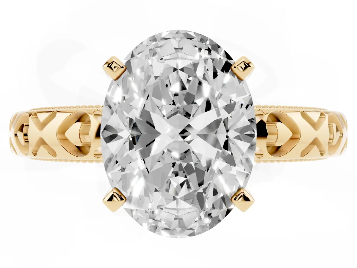 Oval Cut Solitaire Diamond Engagement Ring with XO Engraved Band and Four-Prong Setting Yellow gold