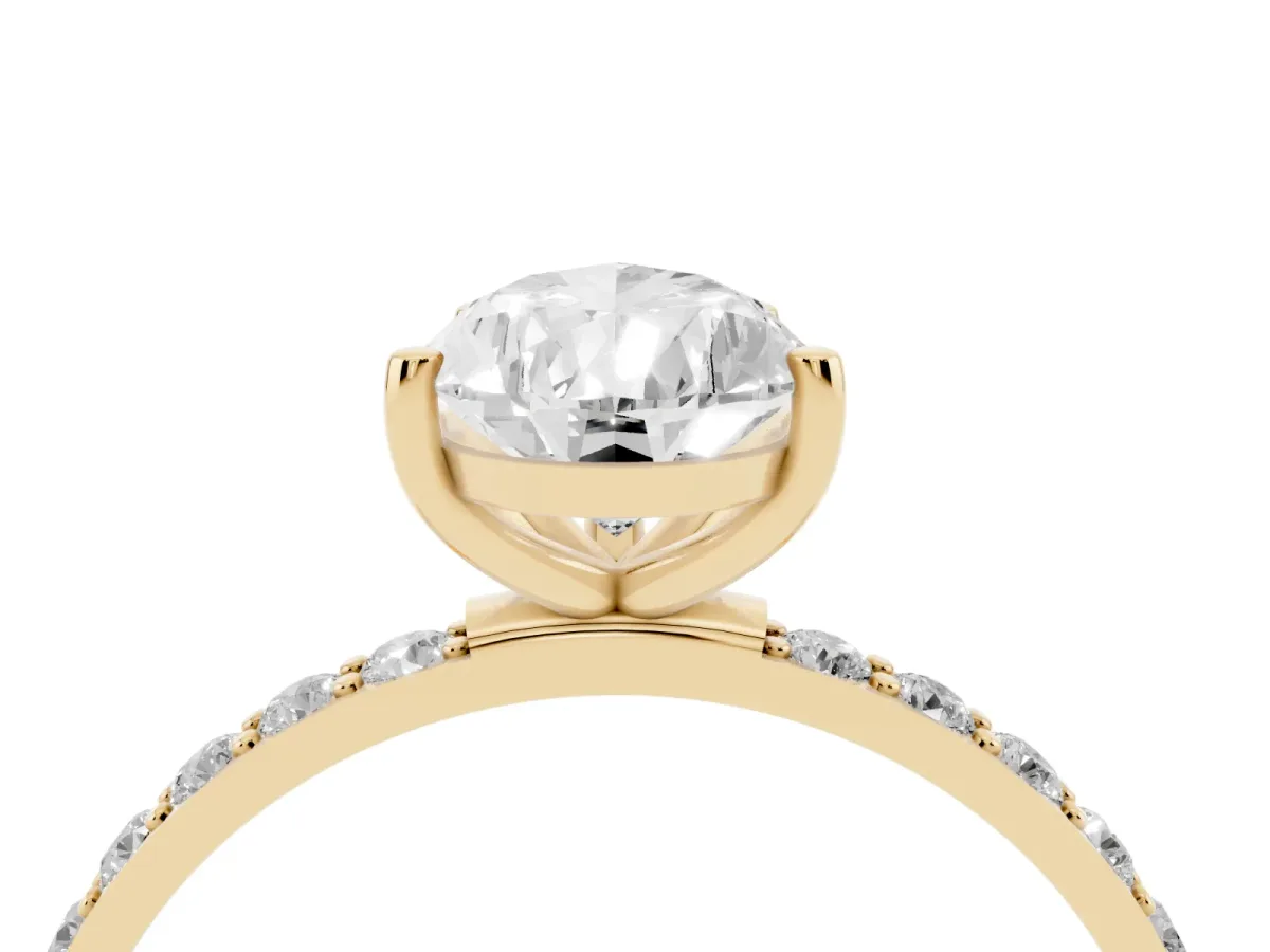 Pear Cut Diamond Solitaire Ring with Round Pavé Shoulders and Prong Setting Yellow gold