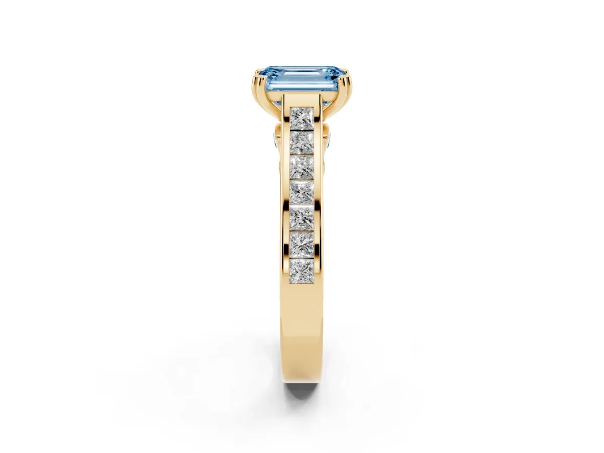 Fancy Blue Emerald Cut Cut Channel Set Solitaire Engagement Ring with Prong Setting Yellow gold