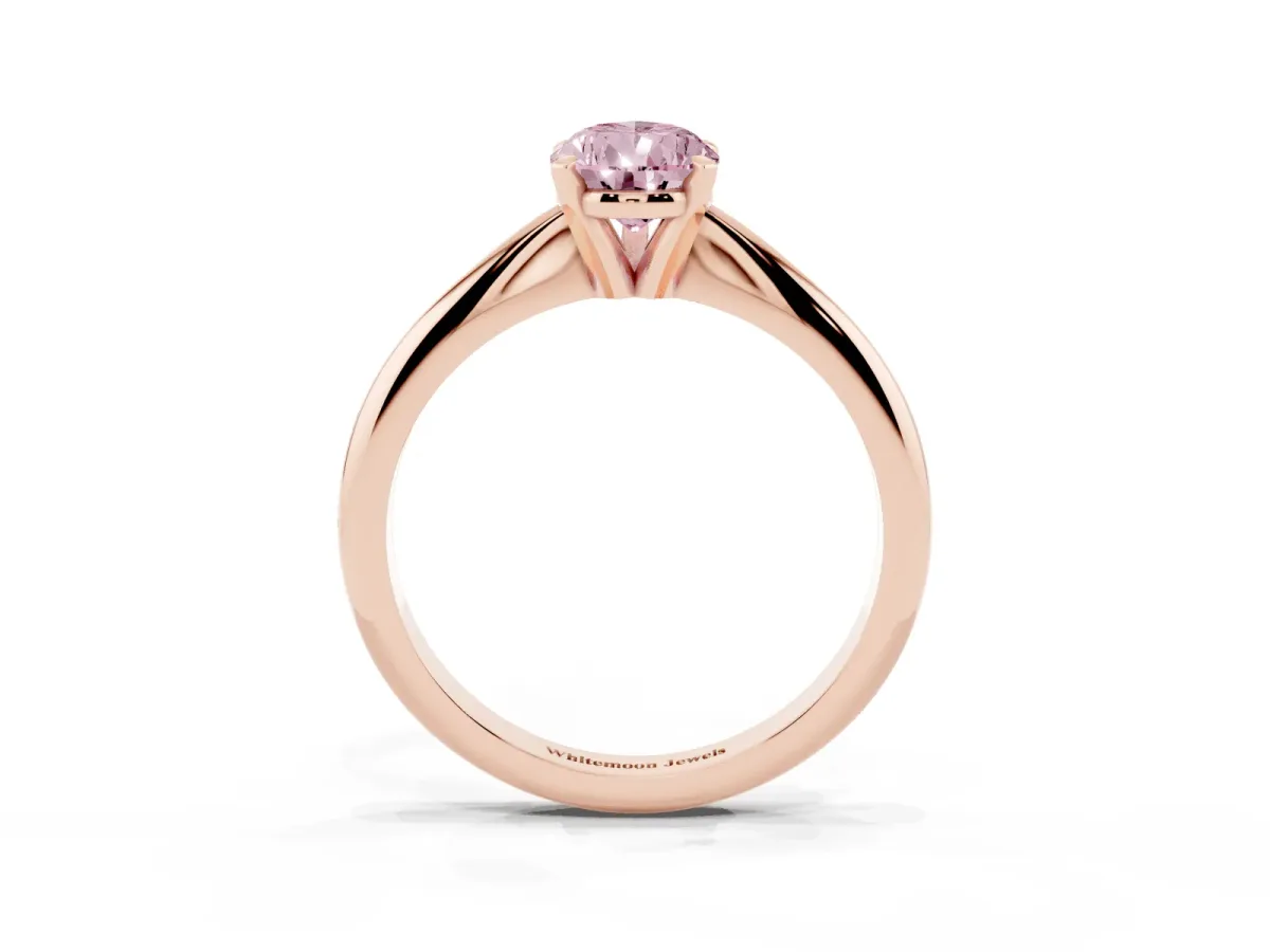 Fancy Pink Pear Cut Cut Solitaire Ring with Four-Prong Setting on a Classic Band Rose gold
