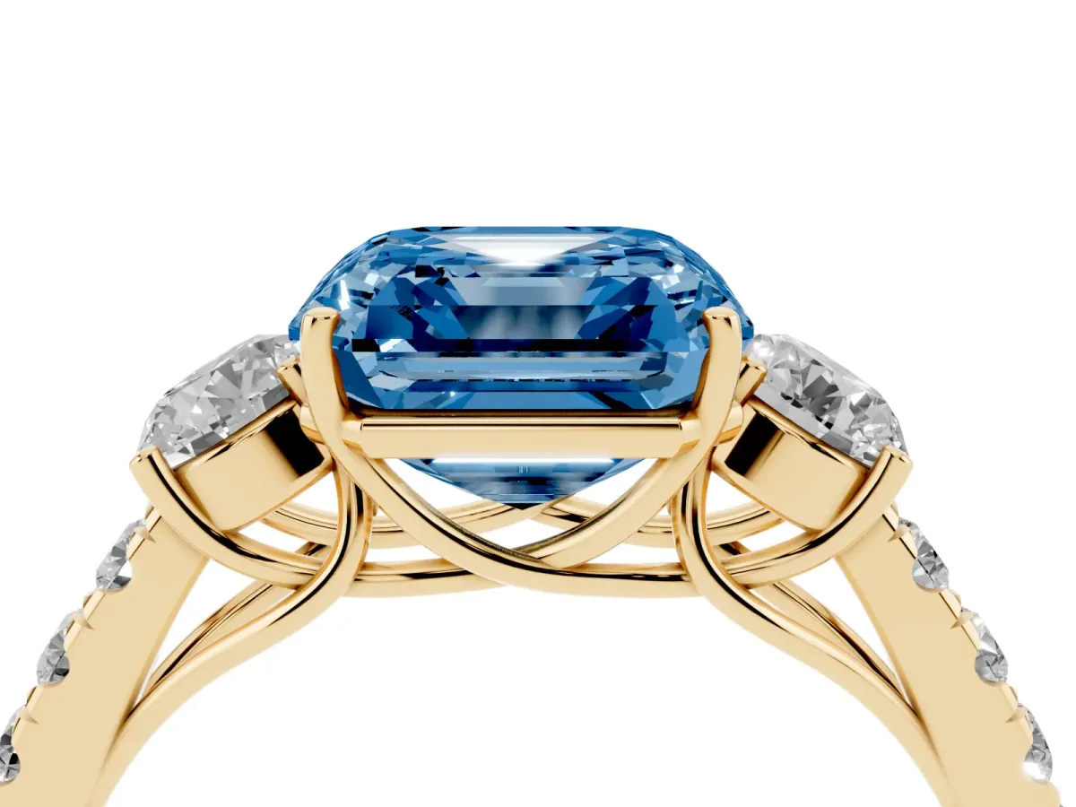 Fancy Blue Asscher Cut Cut Diamond Three-Stone Ring with Round Side Stones and Pavé Band Yellow gold