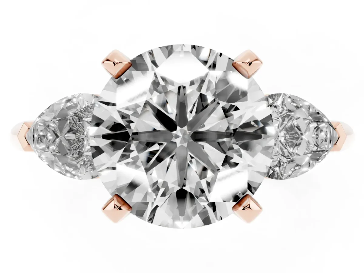 Three-Stone Round Cut Diamond Ring with Pear Side Stones and Four-Prong Setting Rose gold