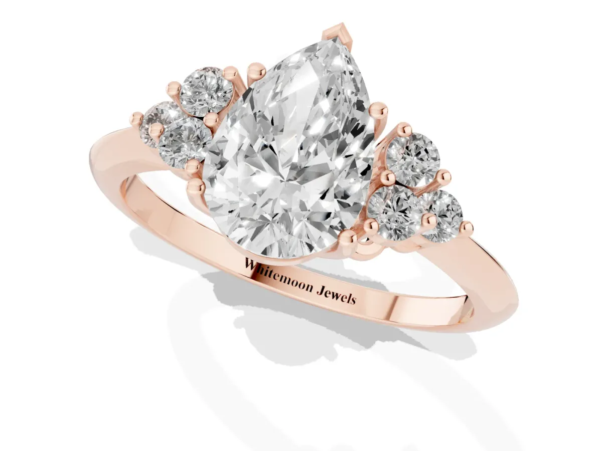 Pear Cut Cut Diamond Cluster Ring with Solitaire Band and Four-Prong Setting Rose gold