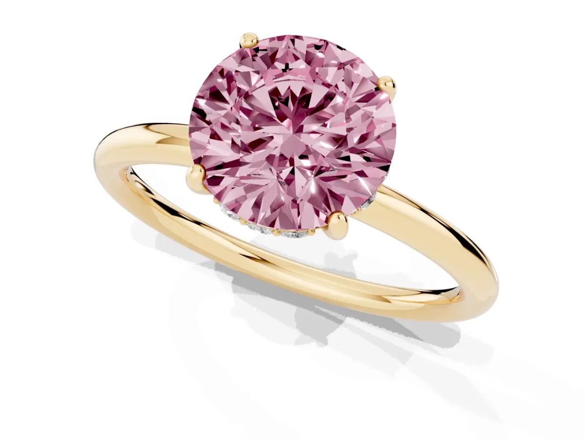 Fancy Pink Round Cut Solitaire Diamond Ring with a Classic Band and Four-Prong Setting Yellow gold