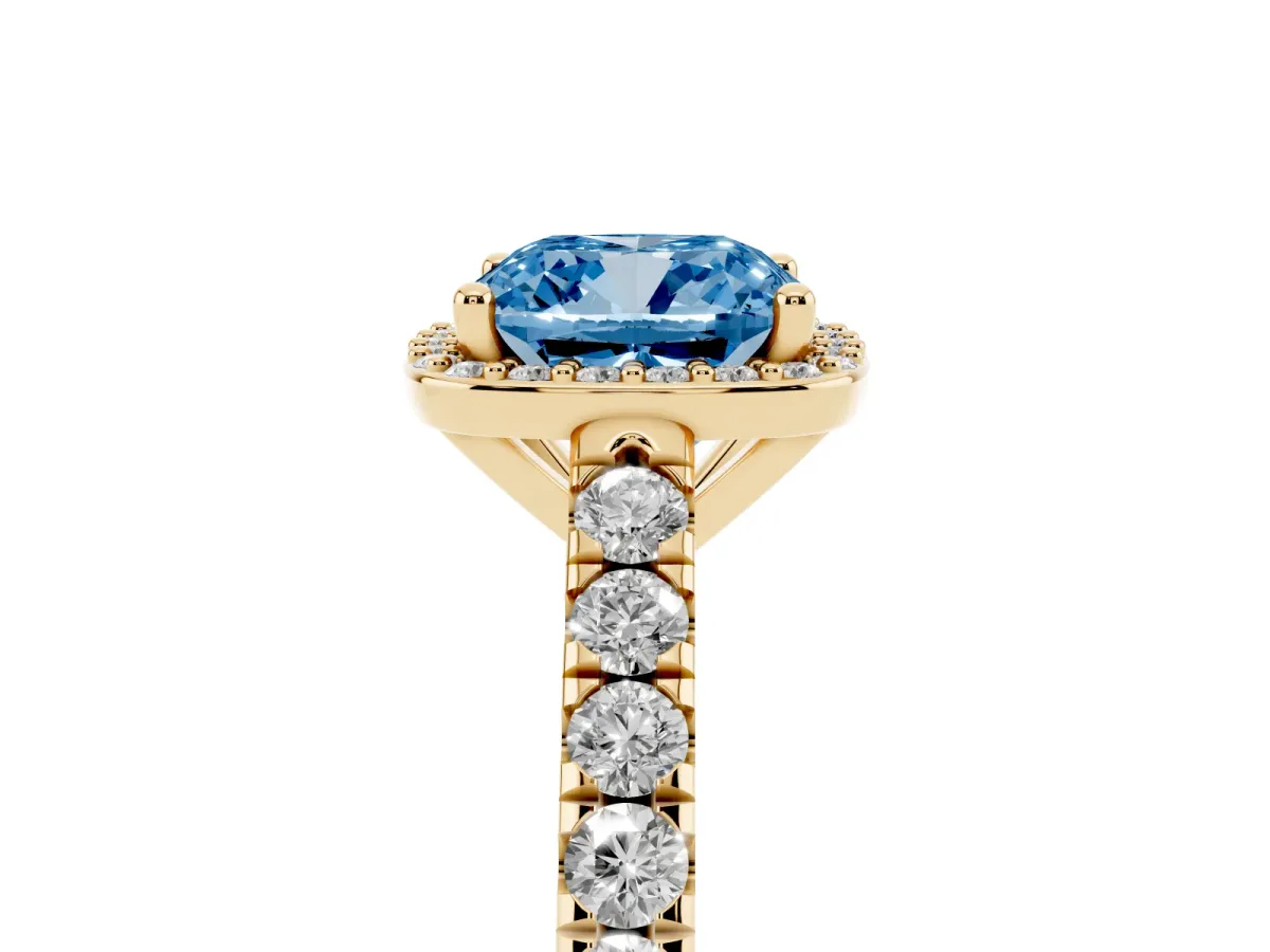 Fancy Blue Cushion Cut Cut Halo Diamond Engagement Ring with Pave Band and Four-Prong Setting Yellow gold