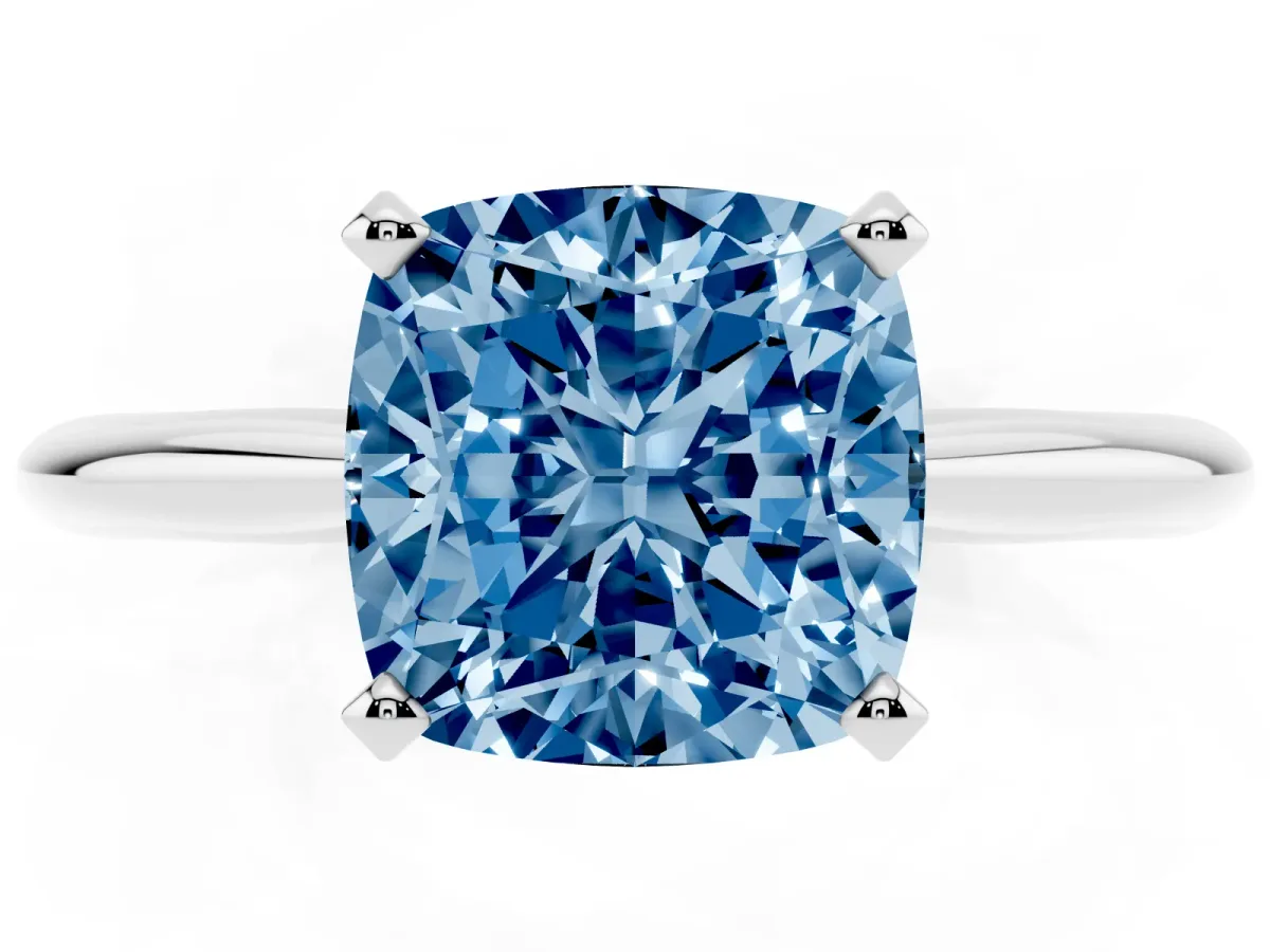 Fancy Blue Cushion Cut Cut Solitaire Ring with Four-Prong Setting on a Classic Band Silver