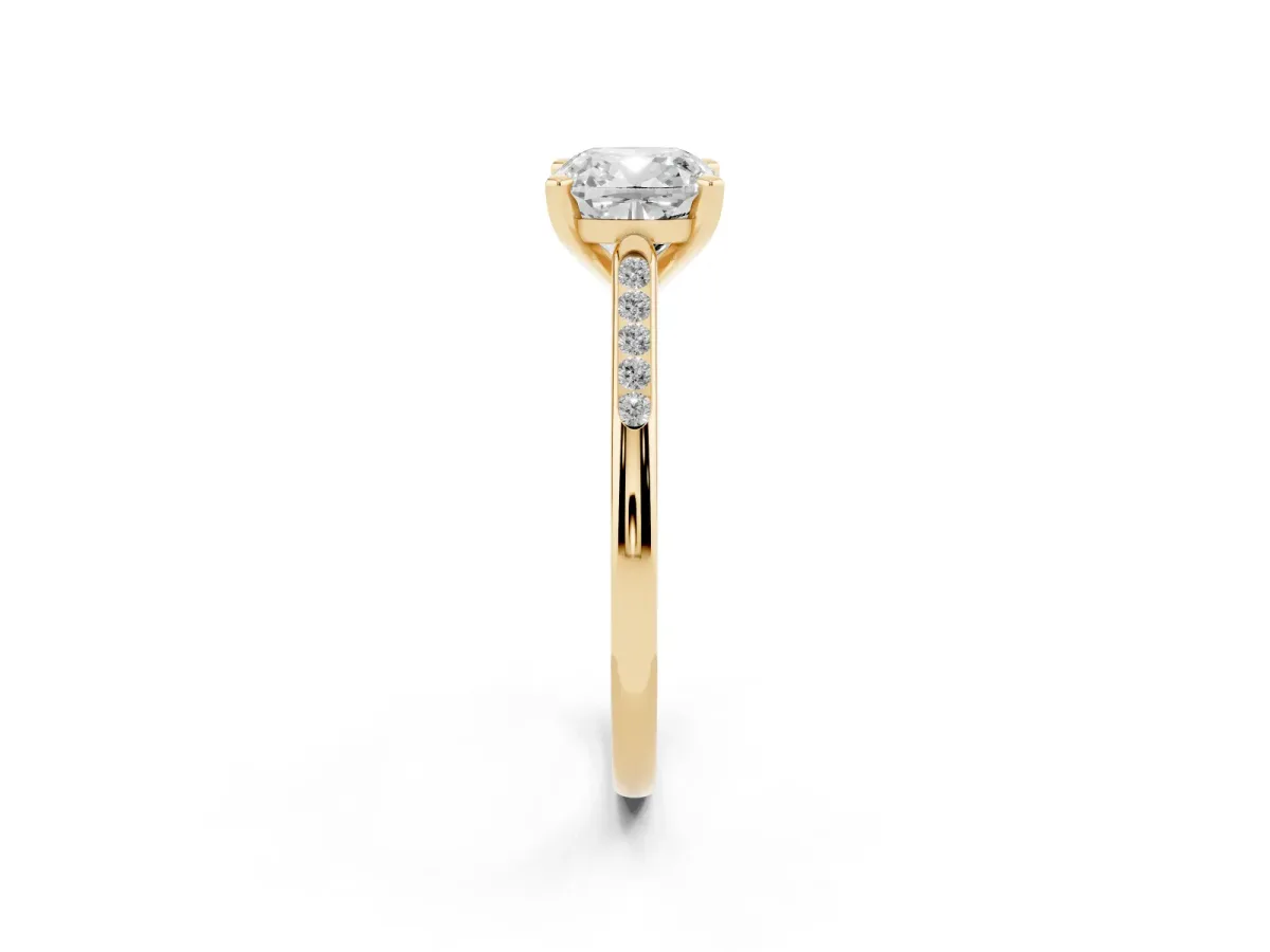 Cushion Cut Diamond Solitaire Ring with Channel Set Round Band and Prong Setting Yellow gold
