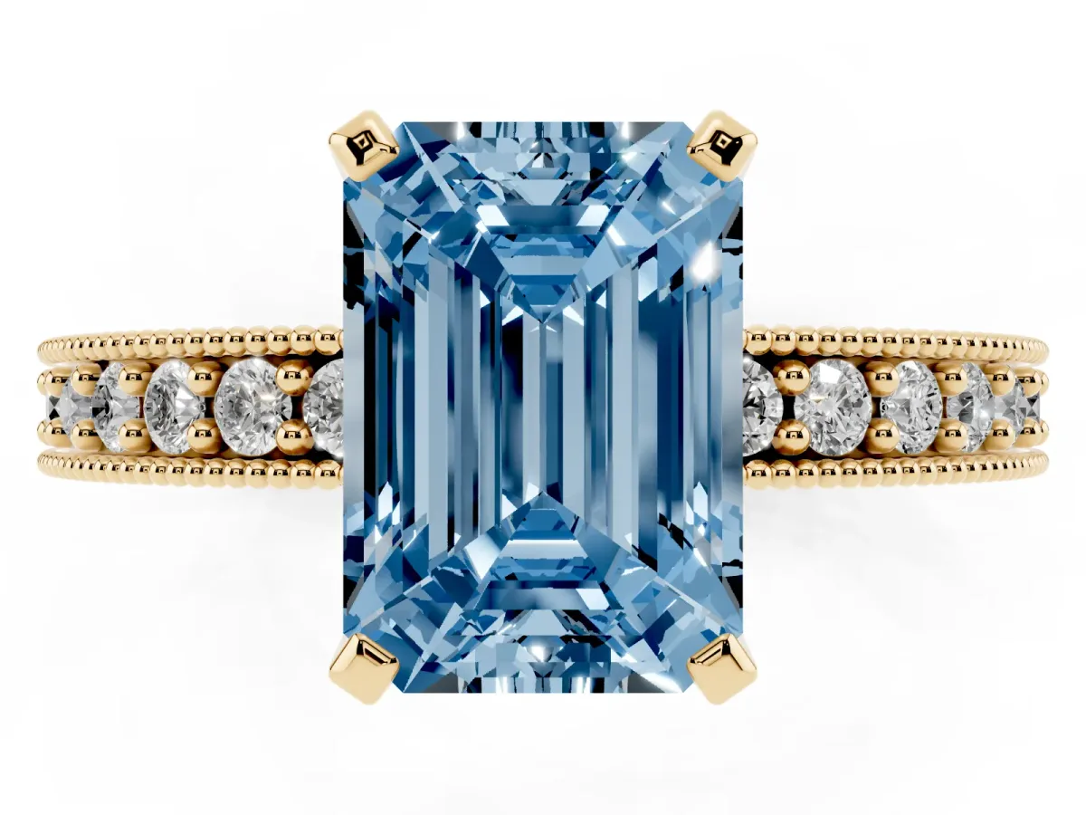 Fancy Blue Emerald Cut Diamond Milgrain Pavé Engagement Ring with Four-Prong Setting Yellow gold