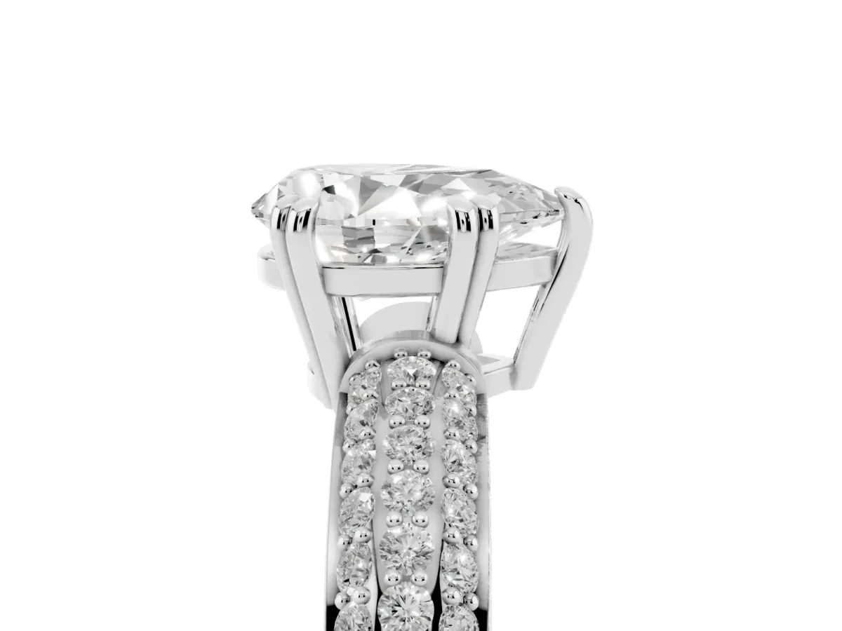 Pear Cut Diamond Solitaire Ring with Multi-Row Round Pavé Band and Prong Setting Silver