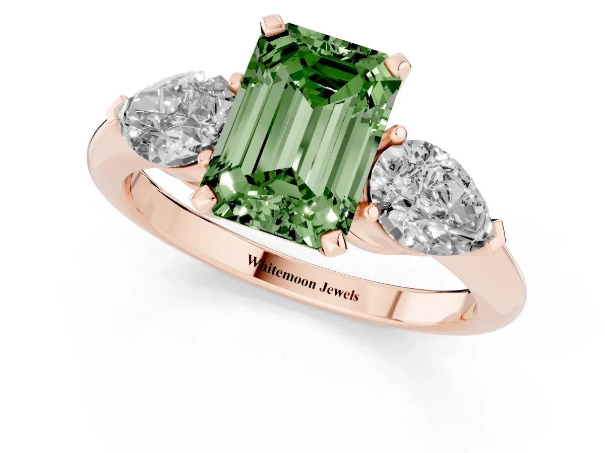 Fancy Green Three-Stone Emerald Cut Diamond Ring with Pear Side Stones and Four-Prong Setting Rose gold