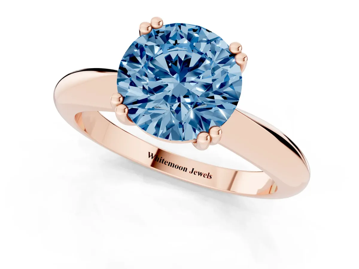 Fancy Blue Round Cut Cut Solitaire Engagement Ring with Tapered Band and Four-Prong Setting Rose gold