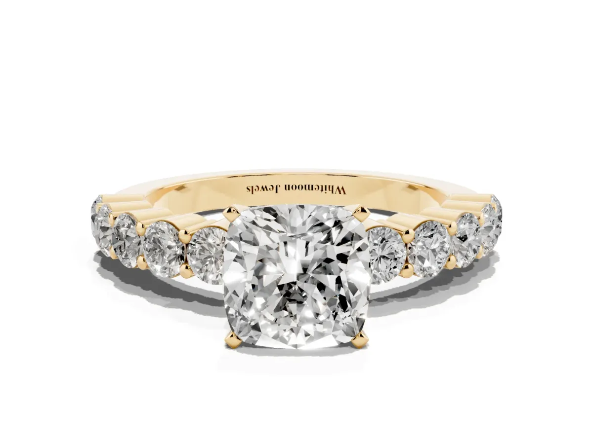 Cushion Cut Diamond Solitaire Ring with Shared Prong Round Side Stones Yellow gold