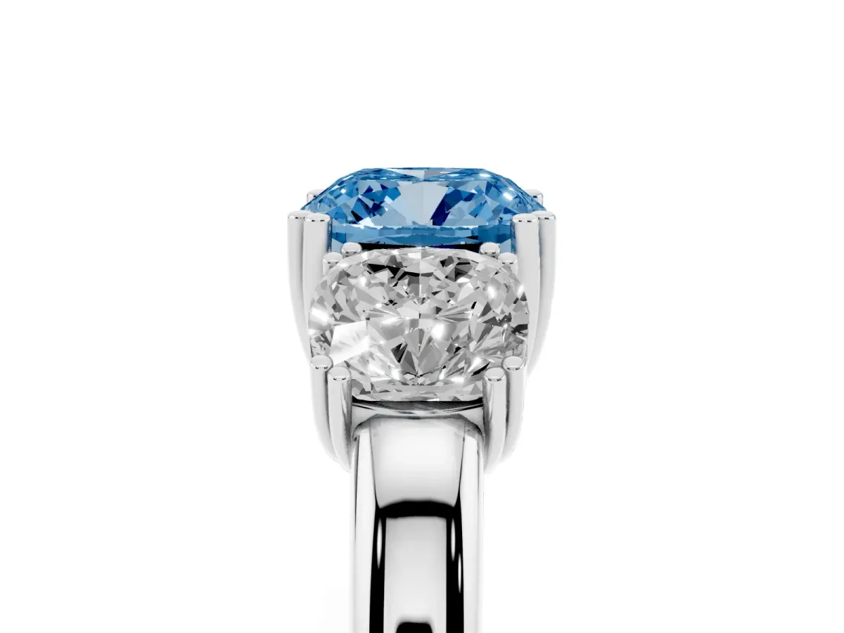 Fancy Blue Three-Stone Cushion Cut Cut Diamond Ring with Channel Set Band and Four-Prong Setting Platinum