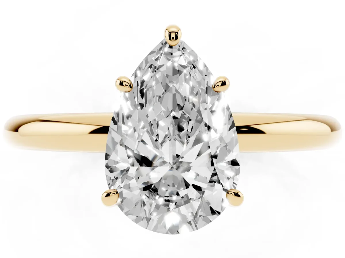 Pear Cut Solitaire Diamond Ring with Four-Prong Setting on a Plain Band Yellow gold