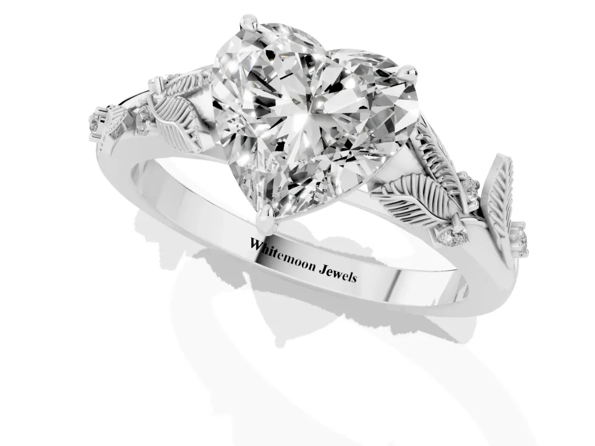 Heart Cut Diamond Solitaire Ring with Leaf Motif Band and Four-Prong Setting Silver