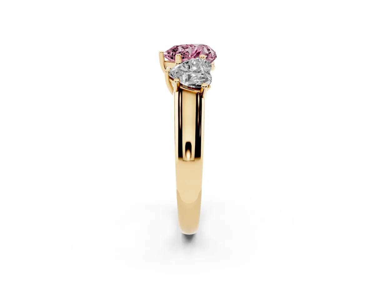 Fancy Pink Heart Cut Three-Stone Diamond Ring with Prong Setting on a Classic Band Yellow gold