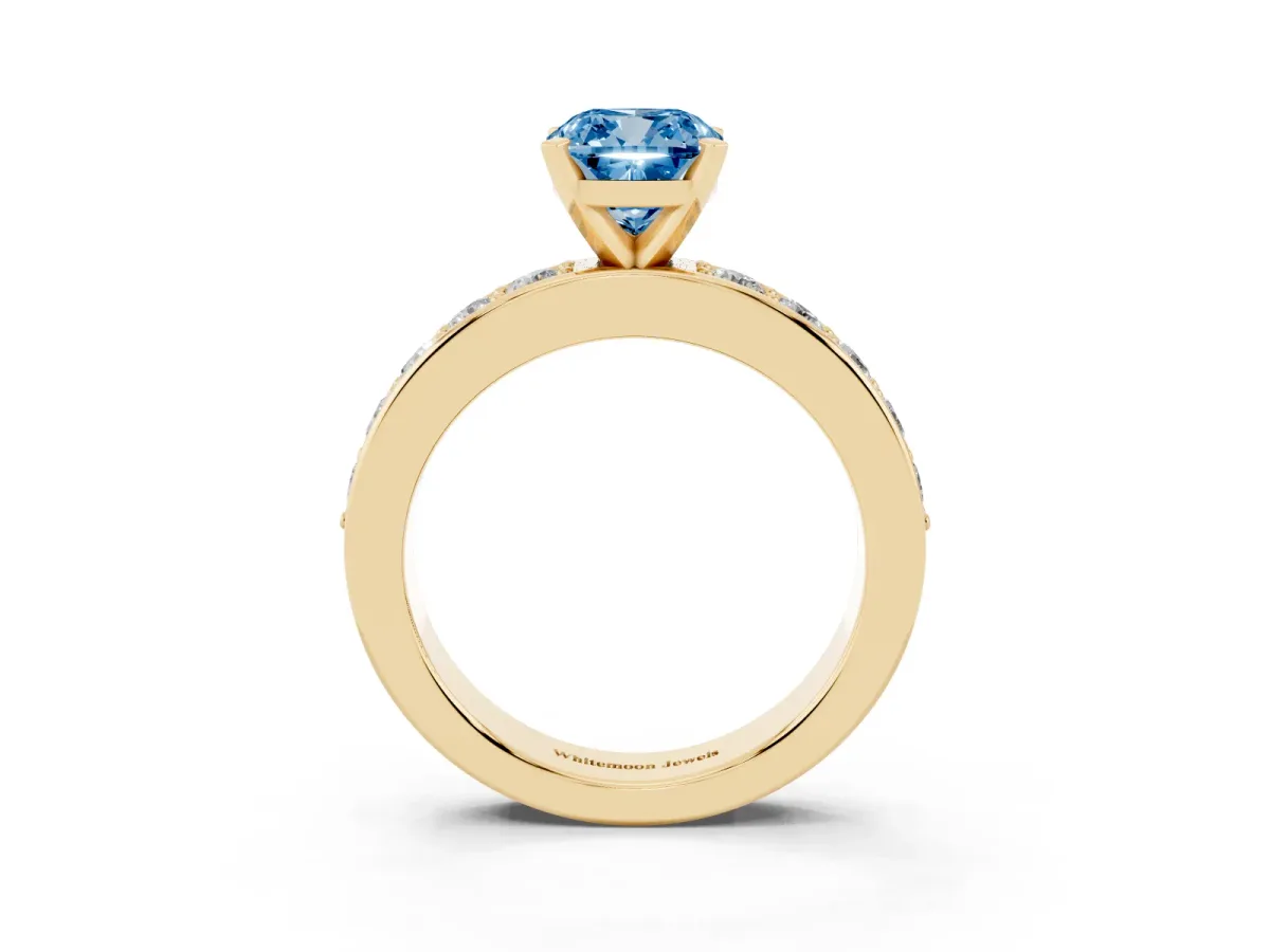 Fancy Blue Cushion Cut Diamond Engagement Ring with Channel Set Round Band and Prong Setting Yellow gold