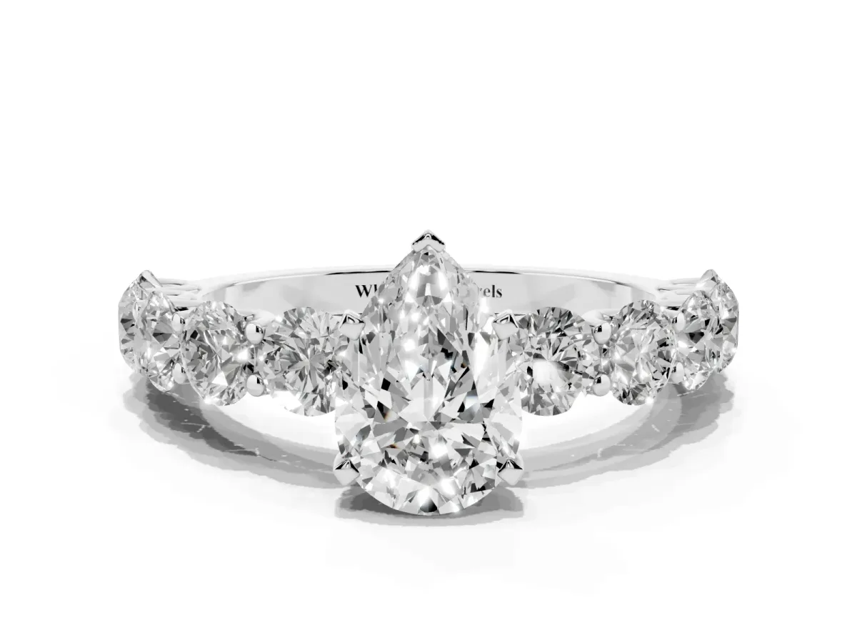 Pear Cut Diamond Prong Setting with Side Stones on a Pave Band Silver
