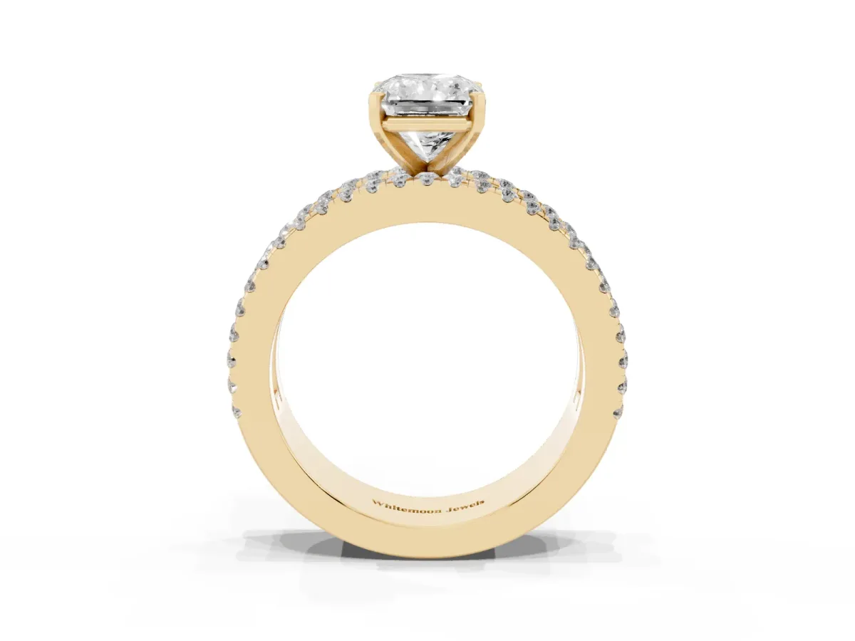 Radiant Cut Diamond Solitaire Ring with Pavé and Channel Set Band Yellow gold