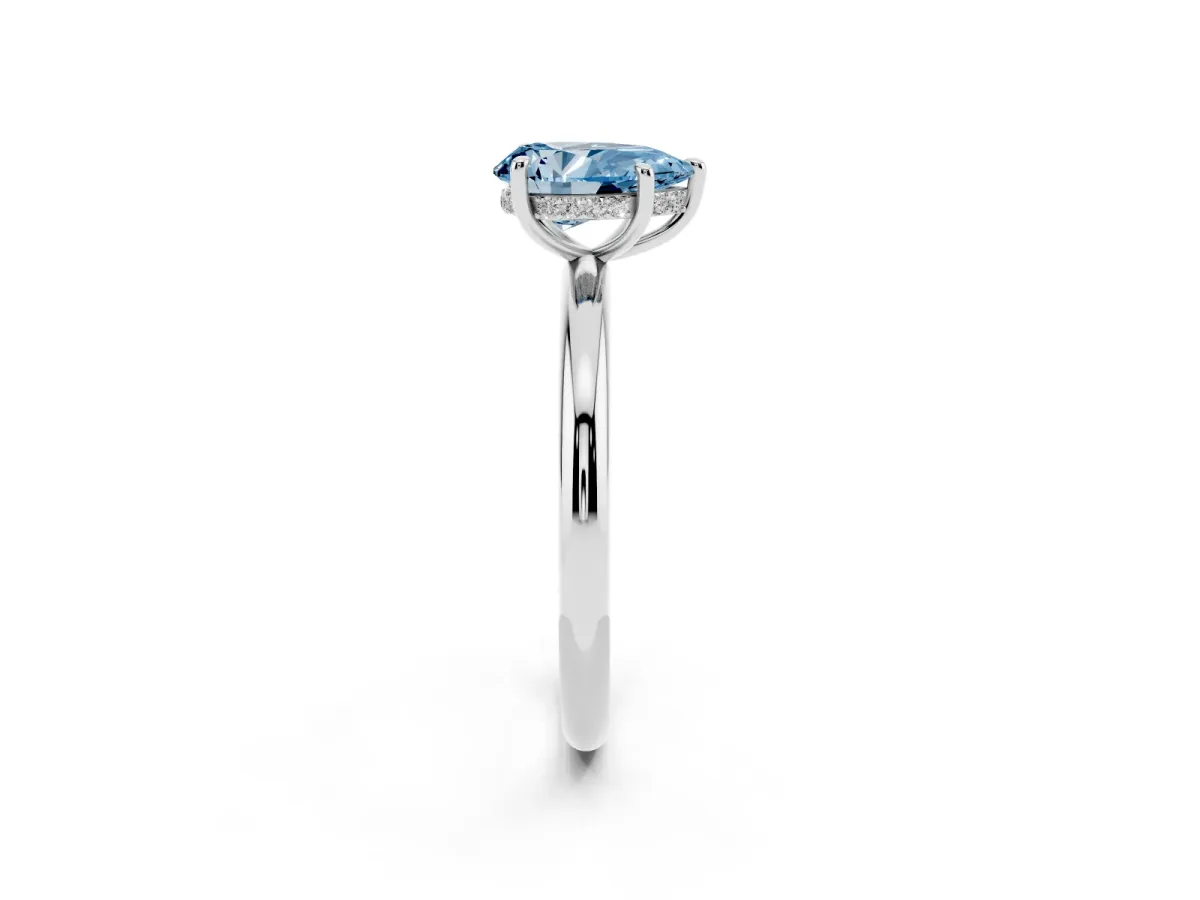 Fancy Blue Pear Cut Diamond Solitaire Ring with Thin Band and Four-Prong Setting Silver