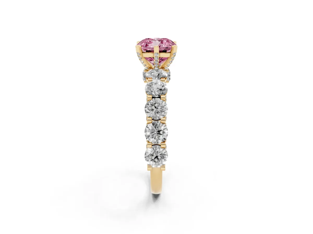 Fancy Pink Cushion Cut Diamond Side Stone Engagement Ring with Four-Prong Setting Yellow gold