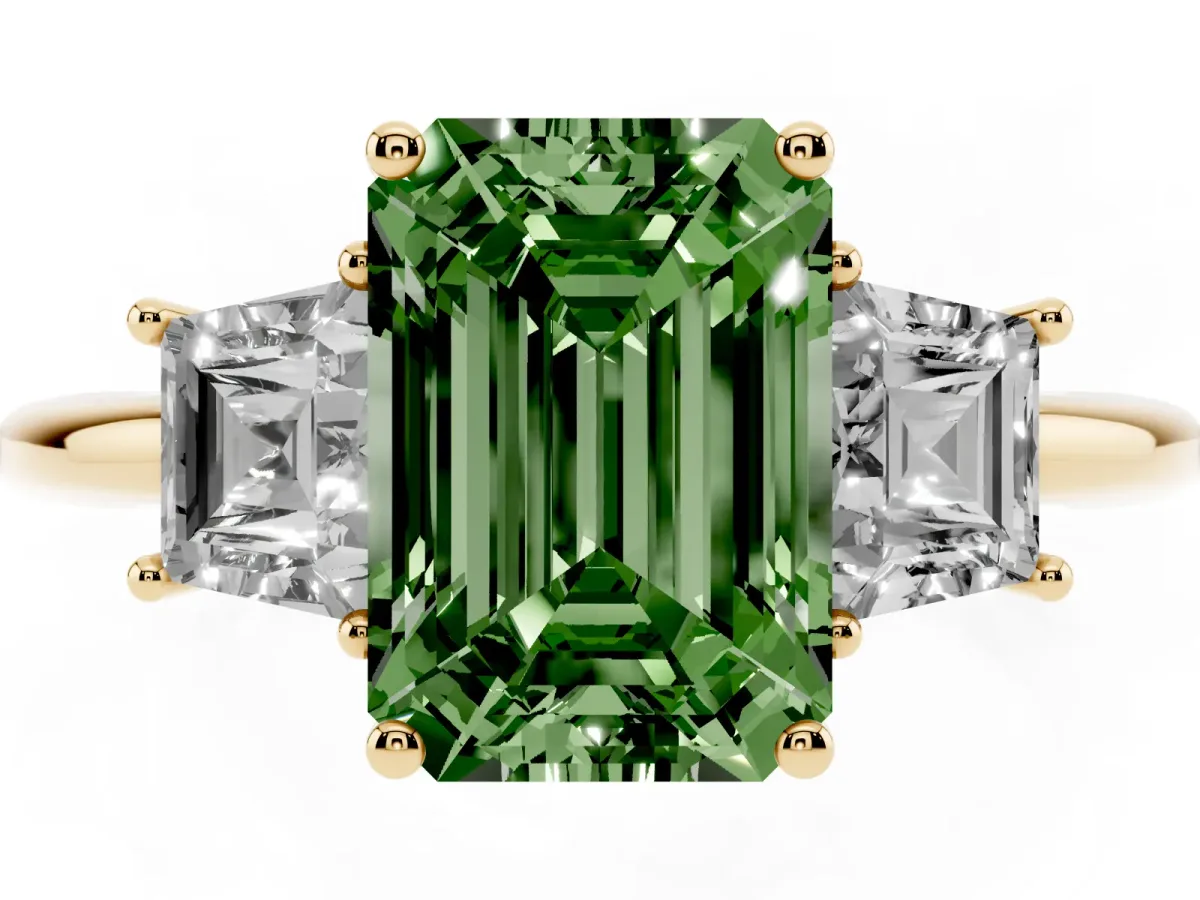 Fancy Green Emerald Cut Diamond Three-Stone Ring with Trapezoid Side Stones and Prong Setting Yellow gold