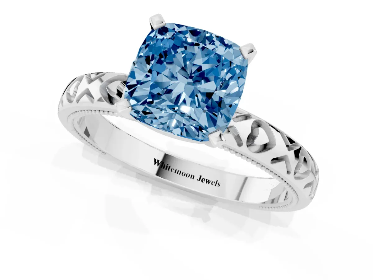 Fancy Blue Cushion Cut Solitaire Diamond Engagement Ring with XO Engraved Band and Four-Prong Setting White gold