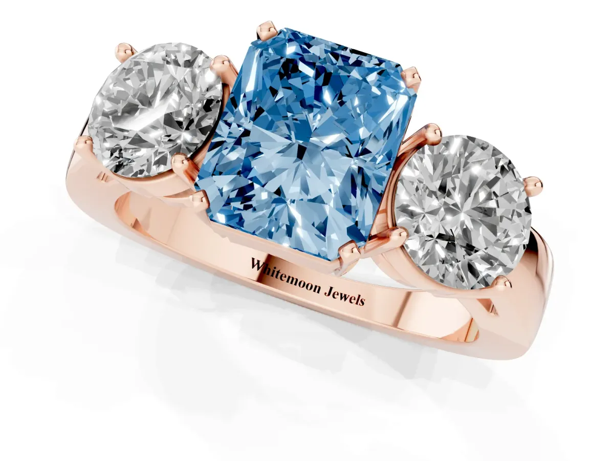 Fancy Blue Three-Stone Radiant Cut Diamond Ring with Round Side Stones, Classic Band, and Four-Prong Setting Rose gold